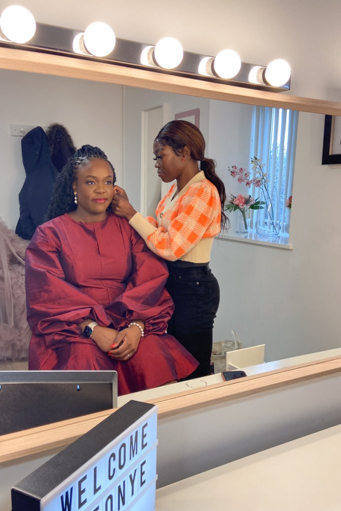 Woman having professional hair and makeup at a Milton Keynes studio looking relaxed and confident