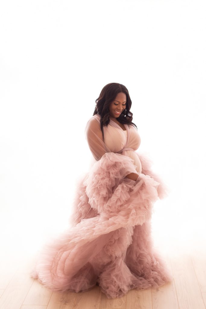 Expecting mother during a maternity portrait session at Wani Olatunde Photography Milton Keynes, showing why maternity photos are worth it